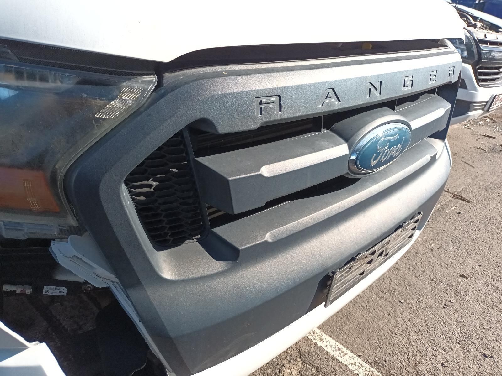 A White Ford Ranger is Sitting in a Parking Lot — South West 4WD Wreckers In Brisbane, QLD