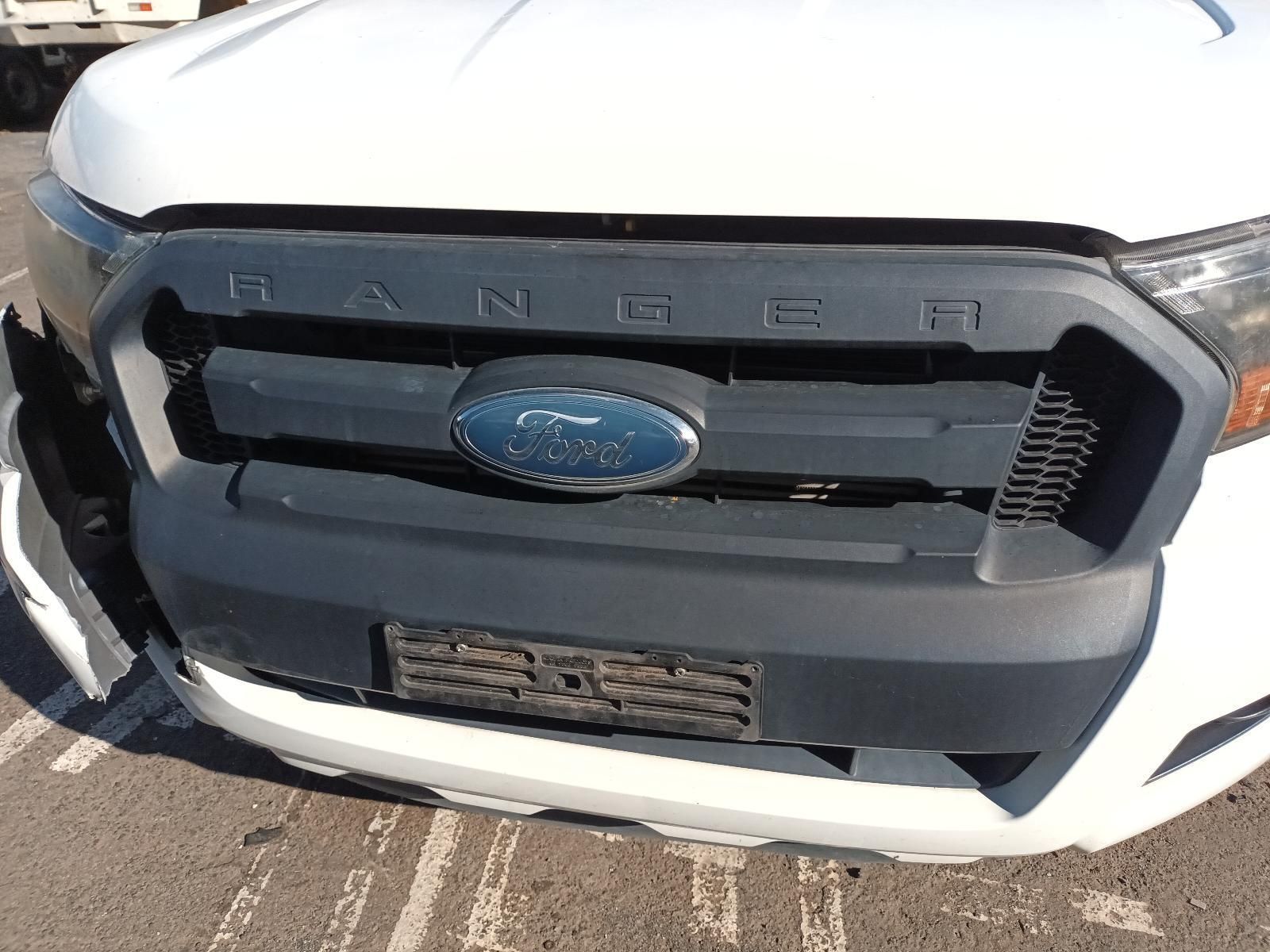 A White Ford Ranger is Parked in a Parking Lot — South West 4WD Wreckers In Brisbane, QLD