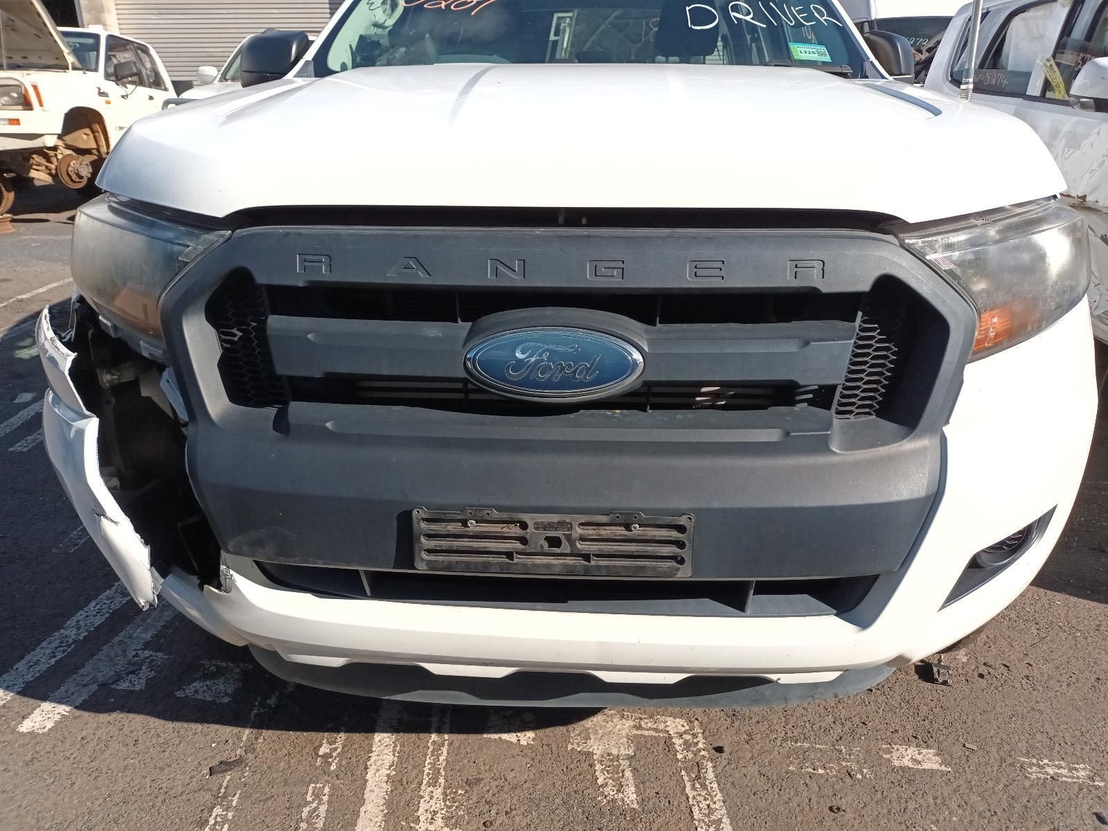 A White Ford Ranger with a Damaged Front Bumper is Parked in a Parking Lot — South West 4WD Wreckers In Brisbane, QLD