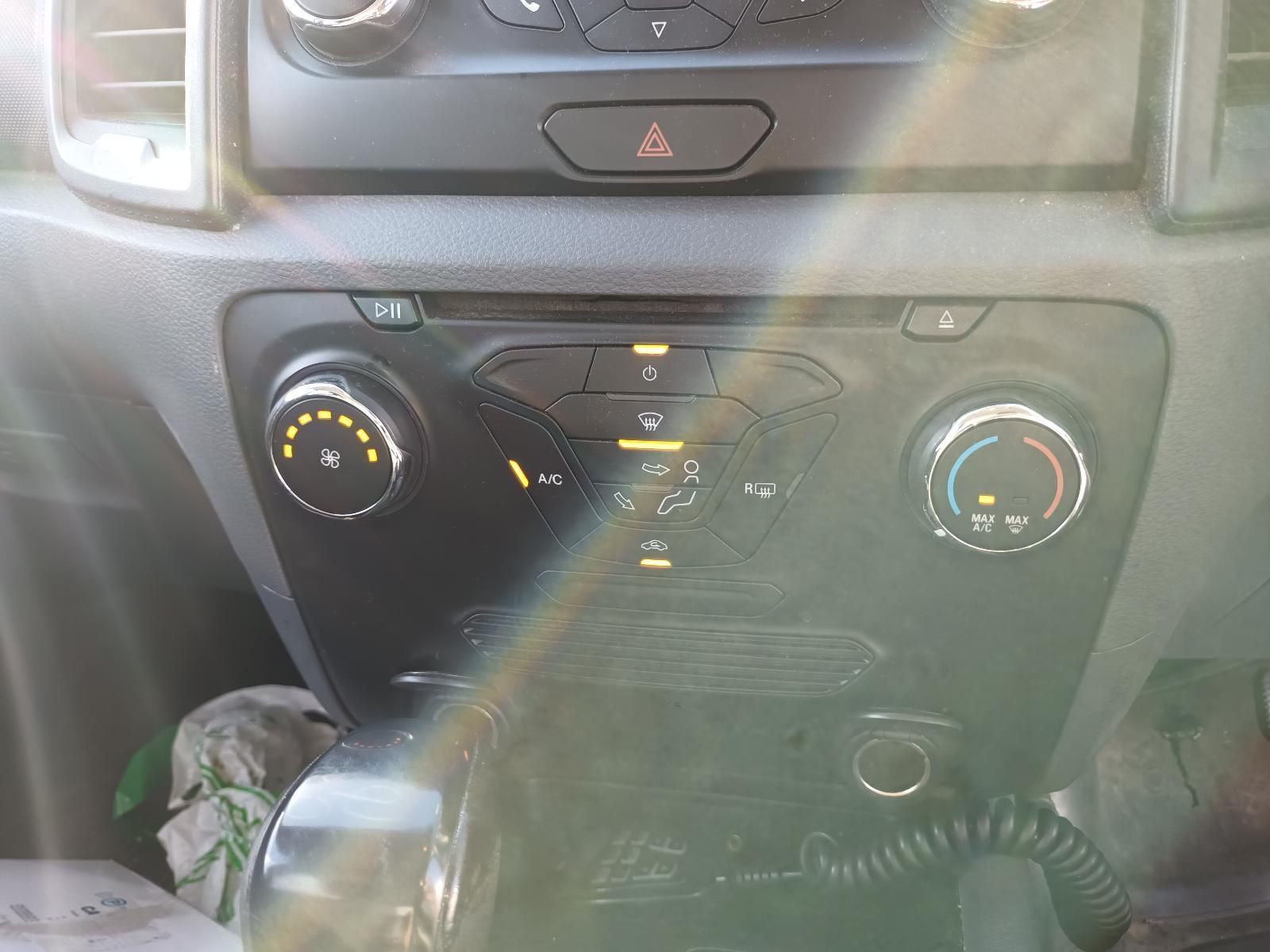 A Close Up of a Car Dashboard with a Radio and Air Conditioning Controls — South West 4WD Wreckers In Brisbane, QLD