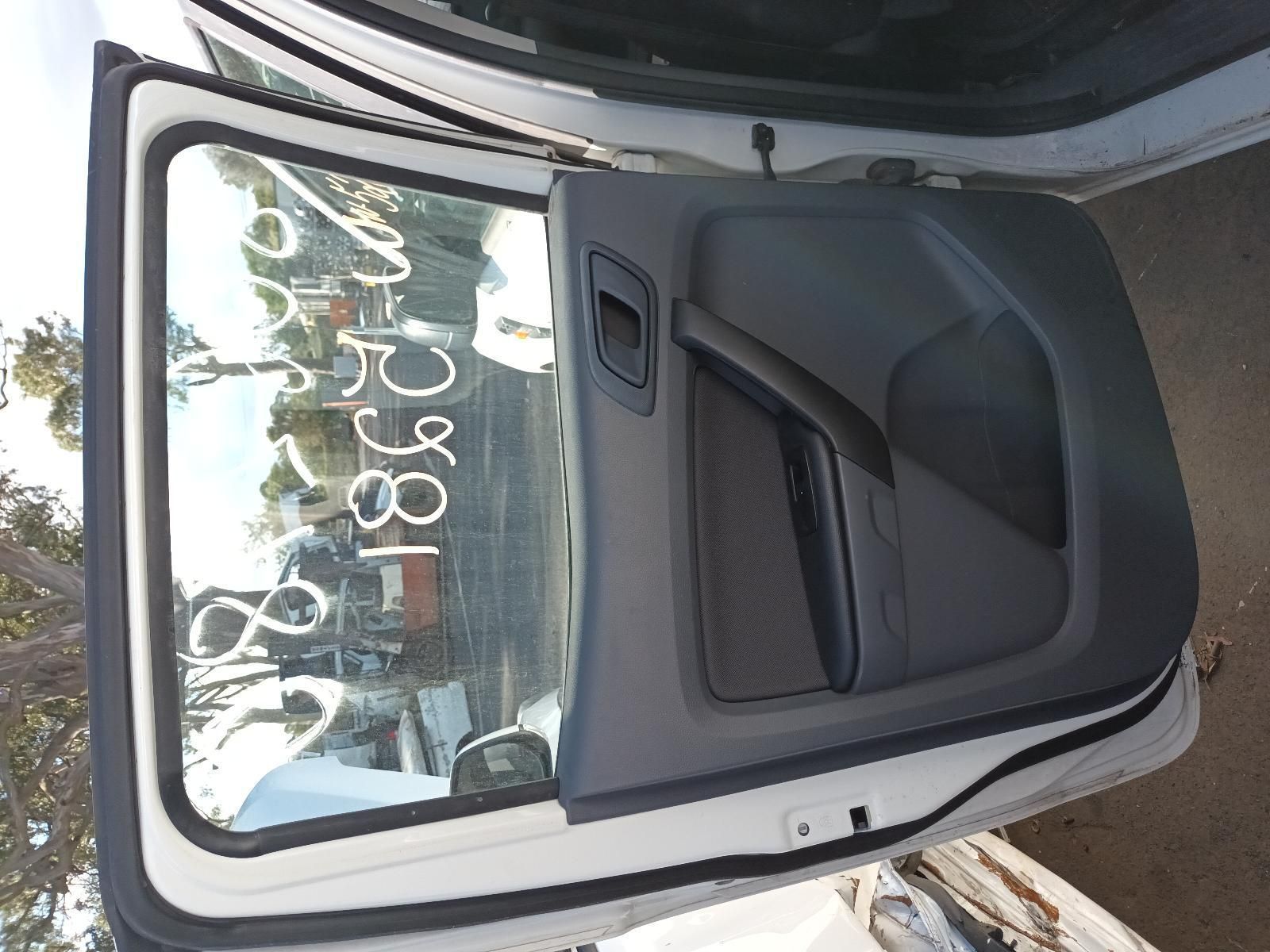 A White Car with the Door Open Has a Written on the Window — South West 4WD Wreckers In Brisbane, QLD
