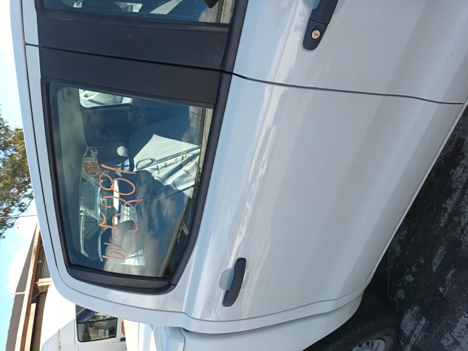 A White Car is Parked on the Side of the Road — South West 4WD Wreckers In Brisbane, QLD