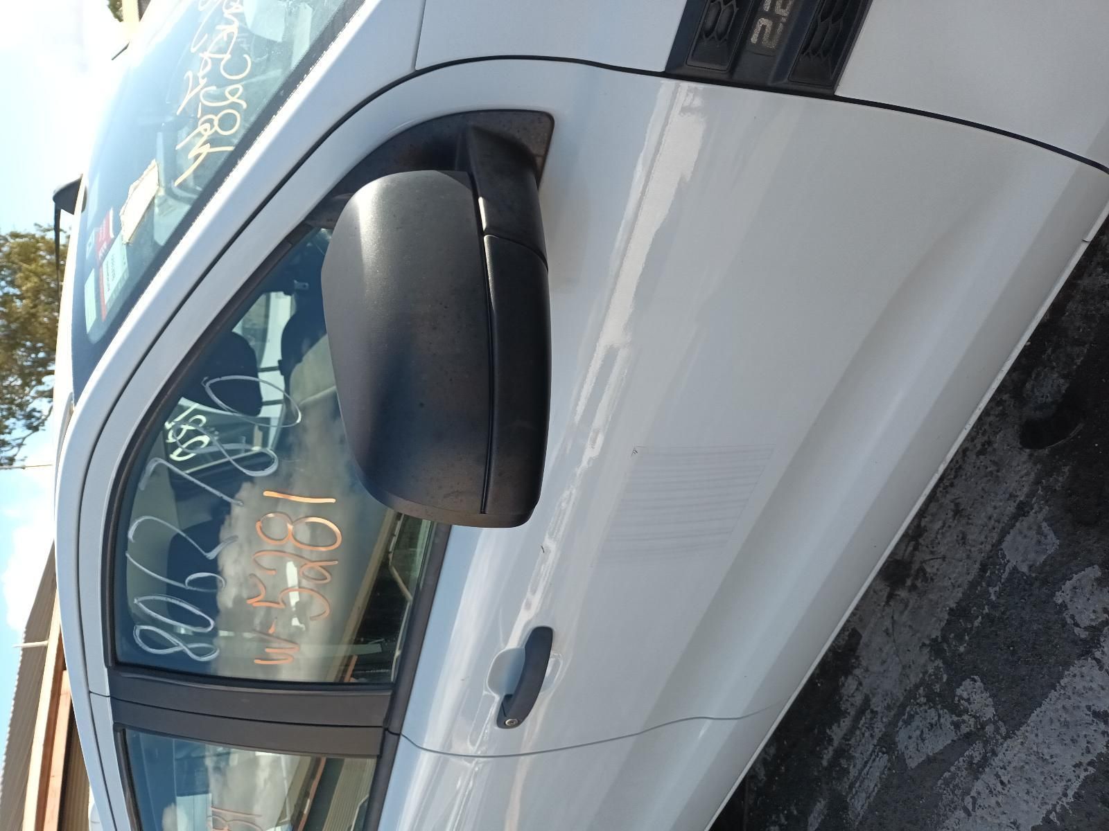 A White Car is Parked on the Side of the Road — South West 4WD Wreckers In Brisbane, QLD