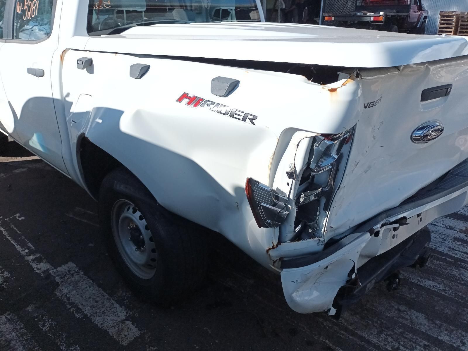 A White Truck with a Damaged on the Back — South West 4WD Wreckers In Brisbane, QLD
