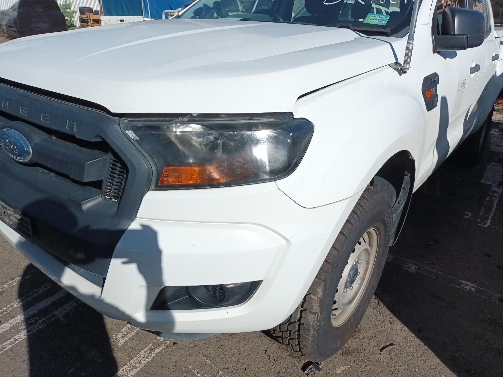 A White Ford Ranger Truck is Parked in a Parking Lot — South West 4WD Wreckers In Brisbane, QLD