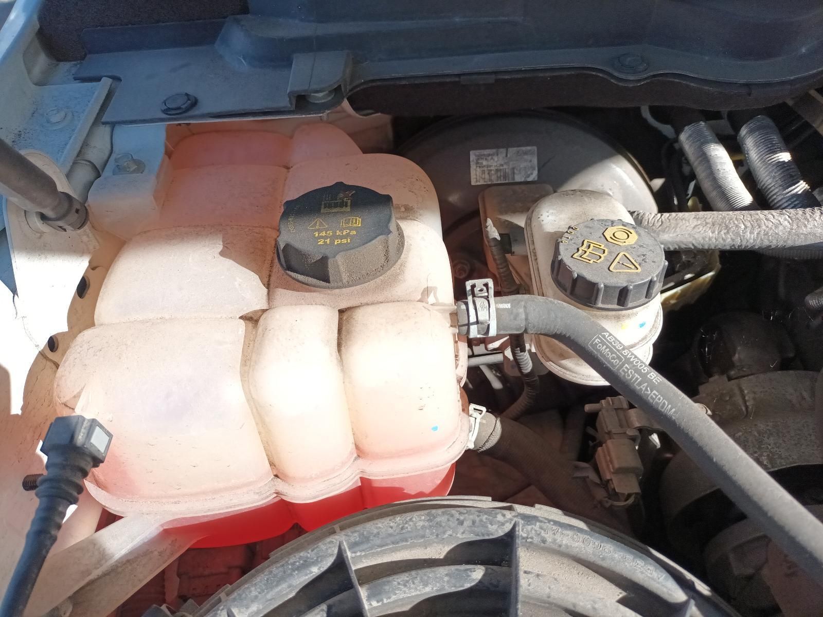 A Close Up of the Engine of a Car with a Red Water Tank — South West 4WD Wreckers In Brisbane, QLD