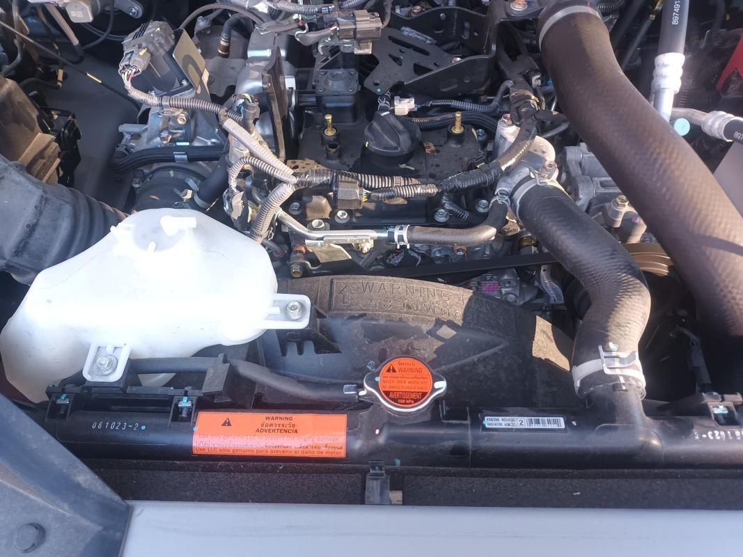 A Person is Working on the Engine of a Car — South West 4WD Wreckers In Brisbane, QLD