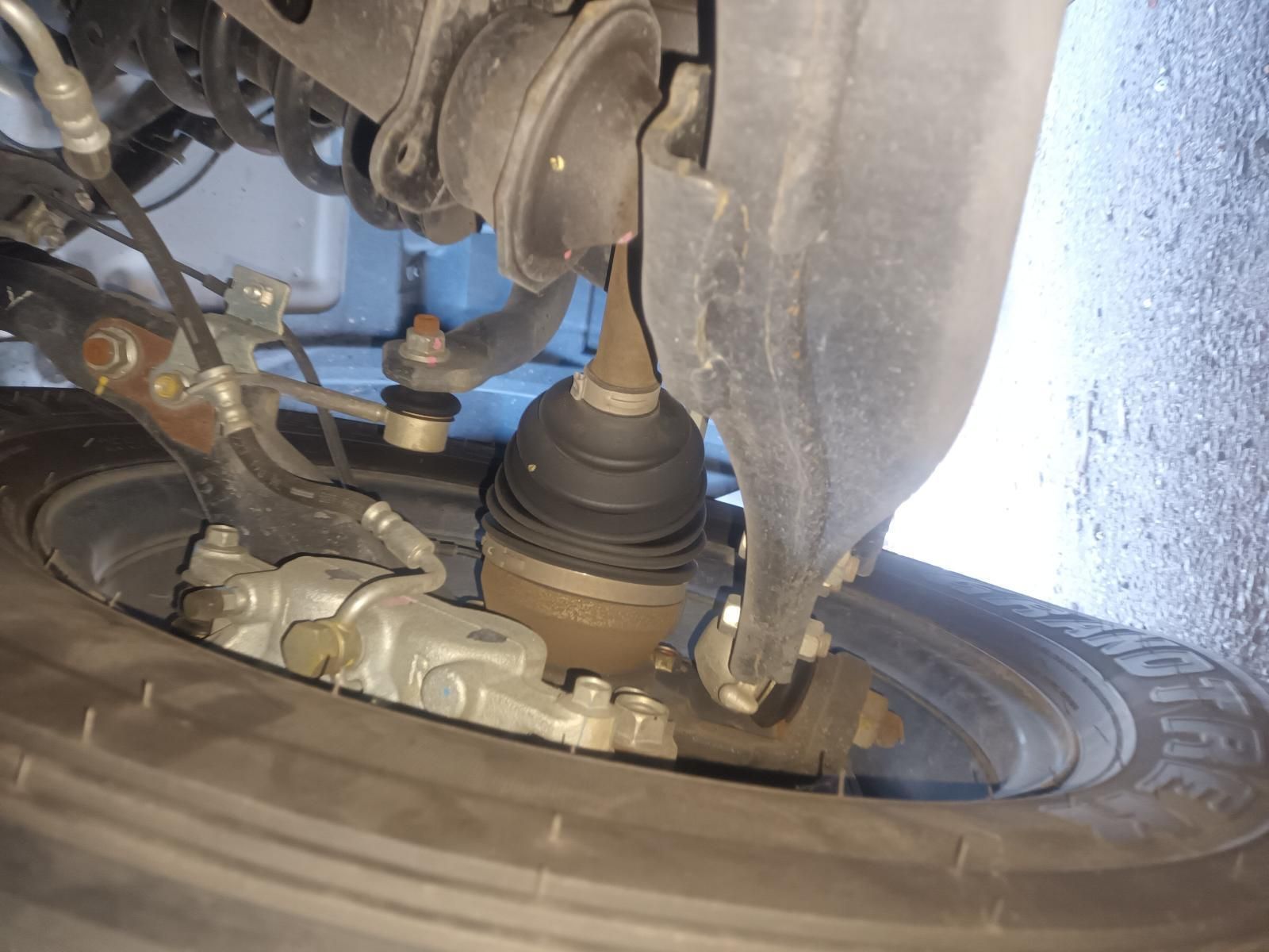 A Close Up of a Car 's Suspension and a Tire — South West 4WD Wreckers In Brisbane, QLD