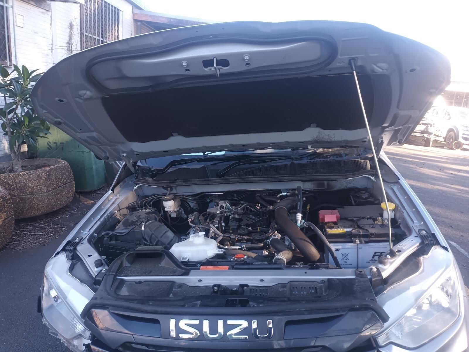 The Hood of a Silver Isuzu Truck is Open — South West 4WD Wreckers In Brisbane, QLD