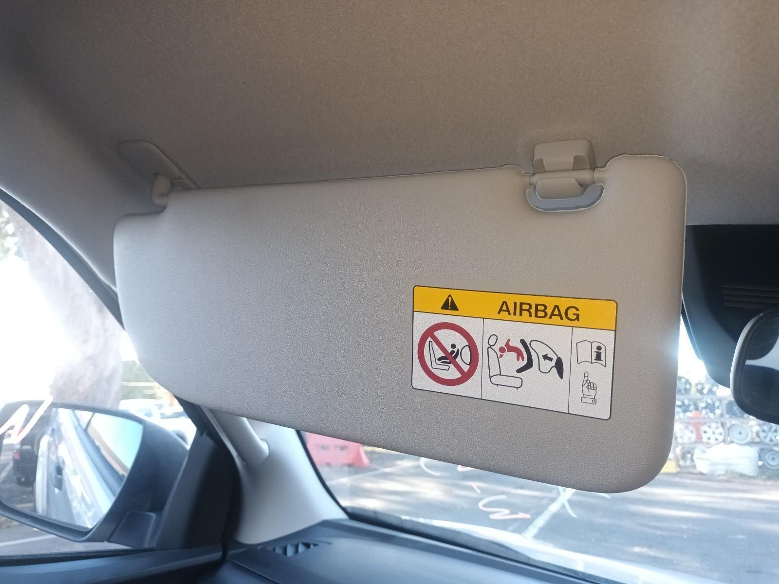 A Sun Visor with a Warning Label on It That Says Airbag — South West 4WD Wreckers In Brisbane, QLD