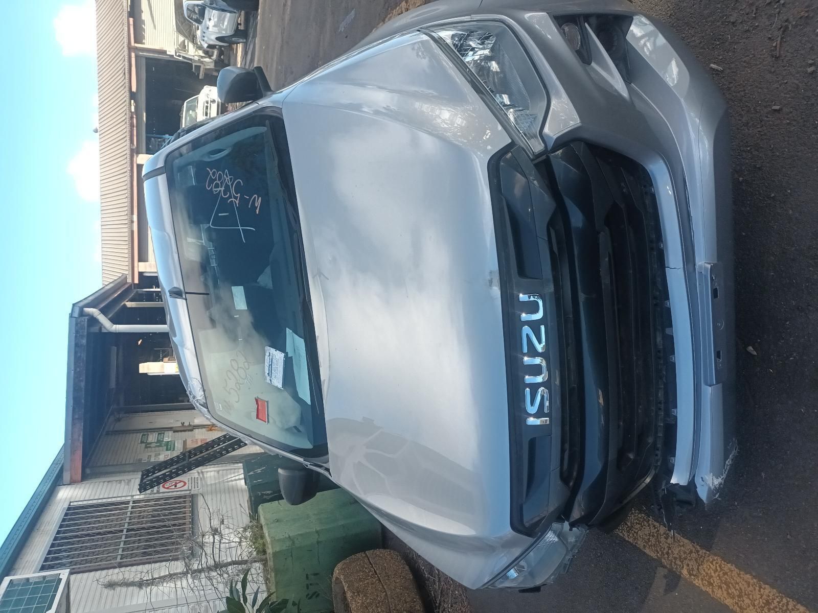 A Silver Isuzu Truck is Parked in a Parking Lot — South West 4WD Wreckers In Brisbane, QLD