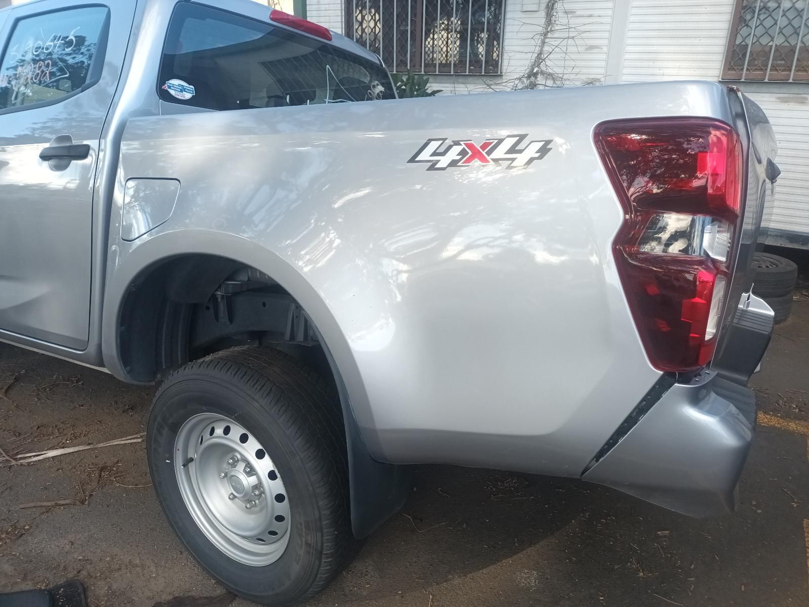 A Silver Pickup Truck is Parked in a Parking Lot — South West 4WD Wreckers In Brisbane, QLD