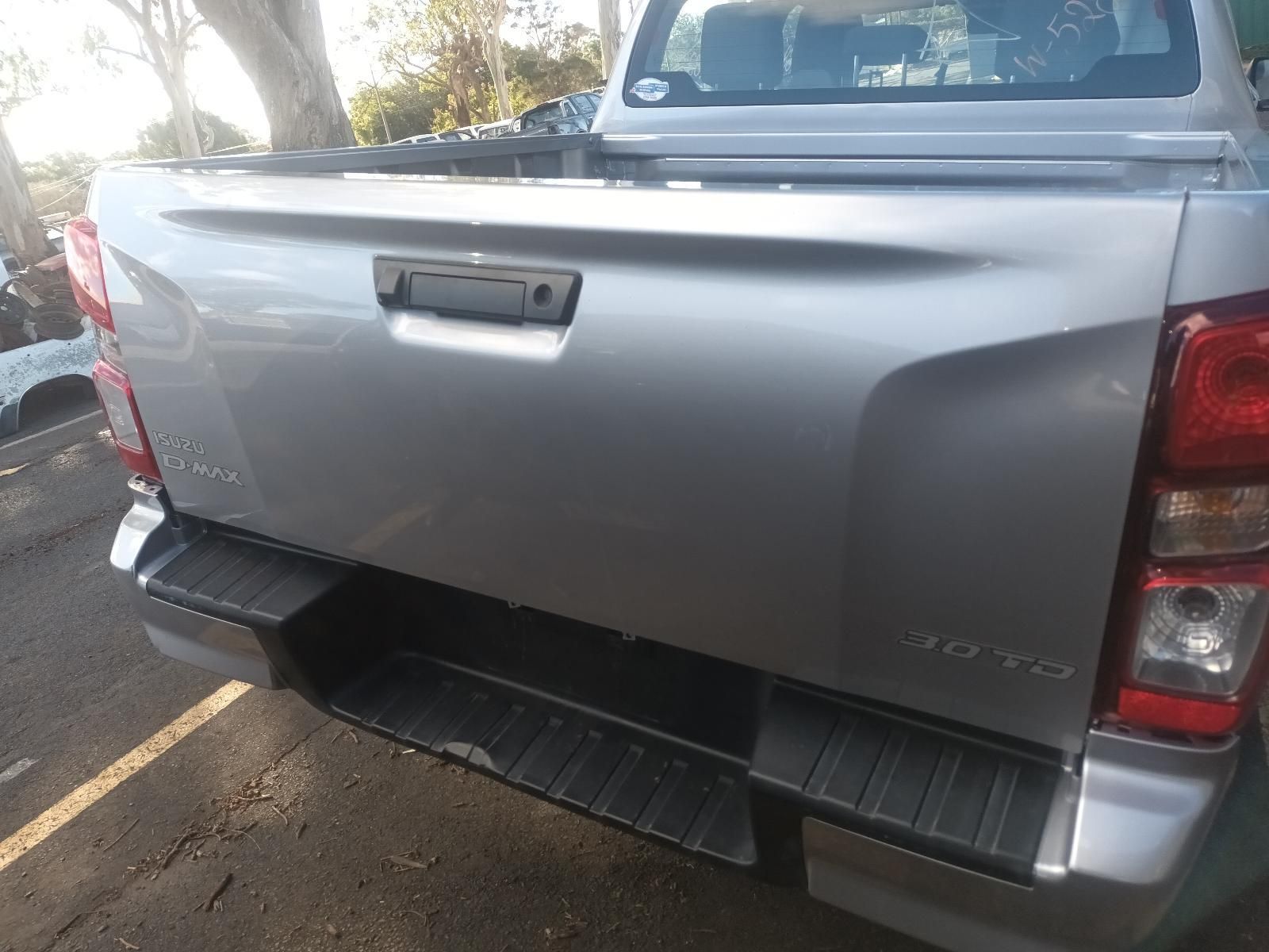 A Silver Pickup Truck is Parked in a Parking Lot— South West 4WD Wreckers In Brisbane, QLD