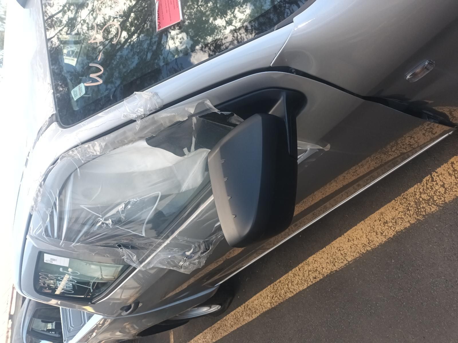 A Silver Car is Parked on the Side of the Road — South West 4WD Wreckers In Brisbane, QLD