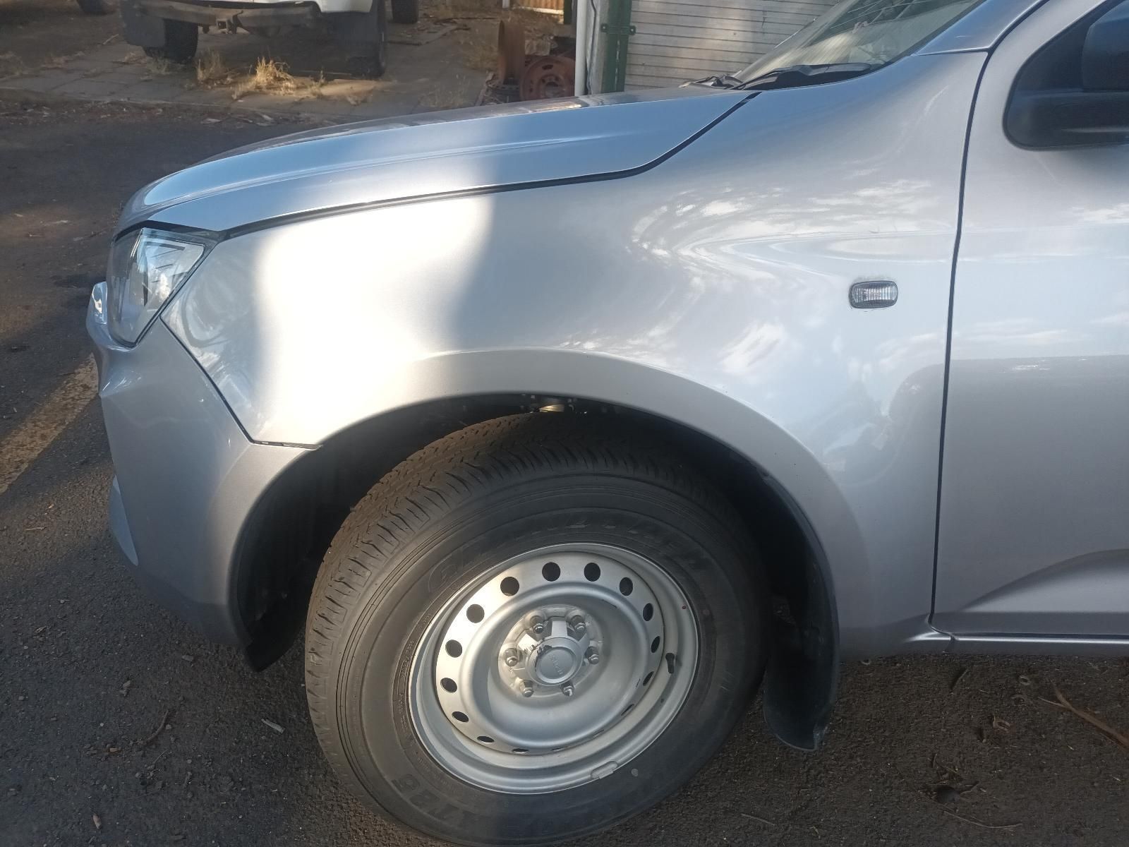 A Silver Truck is Parked on the Side of the Road — South West 4WD Wreckers In Brisbane, QLD