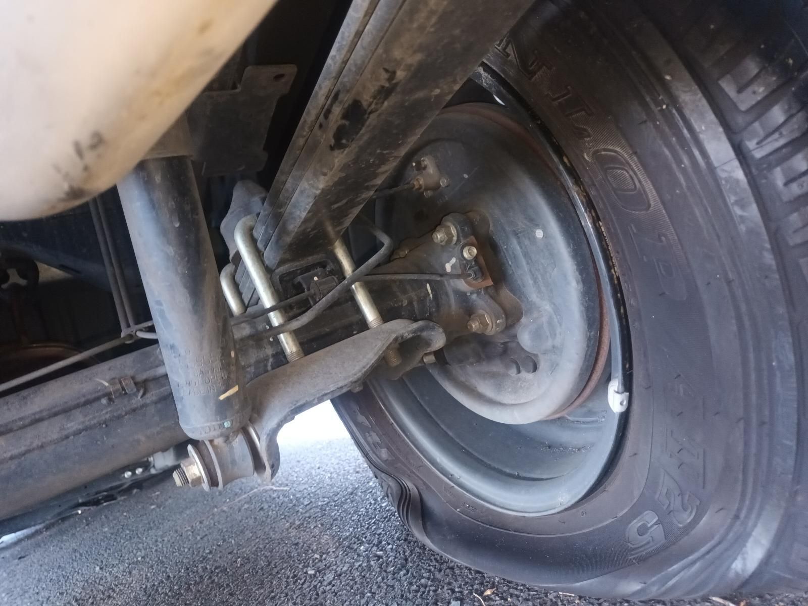 A Close Up of a Car Wheel with a Flat Tire — South West 4WD Wreckers In Brisbane, QLD