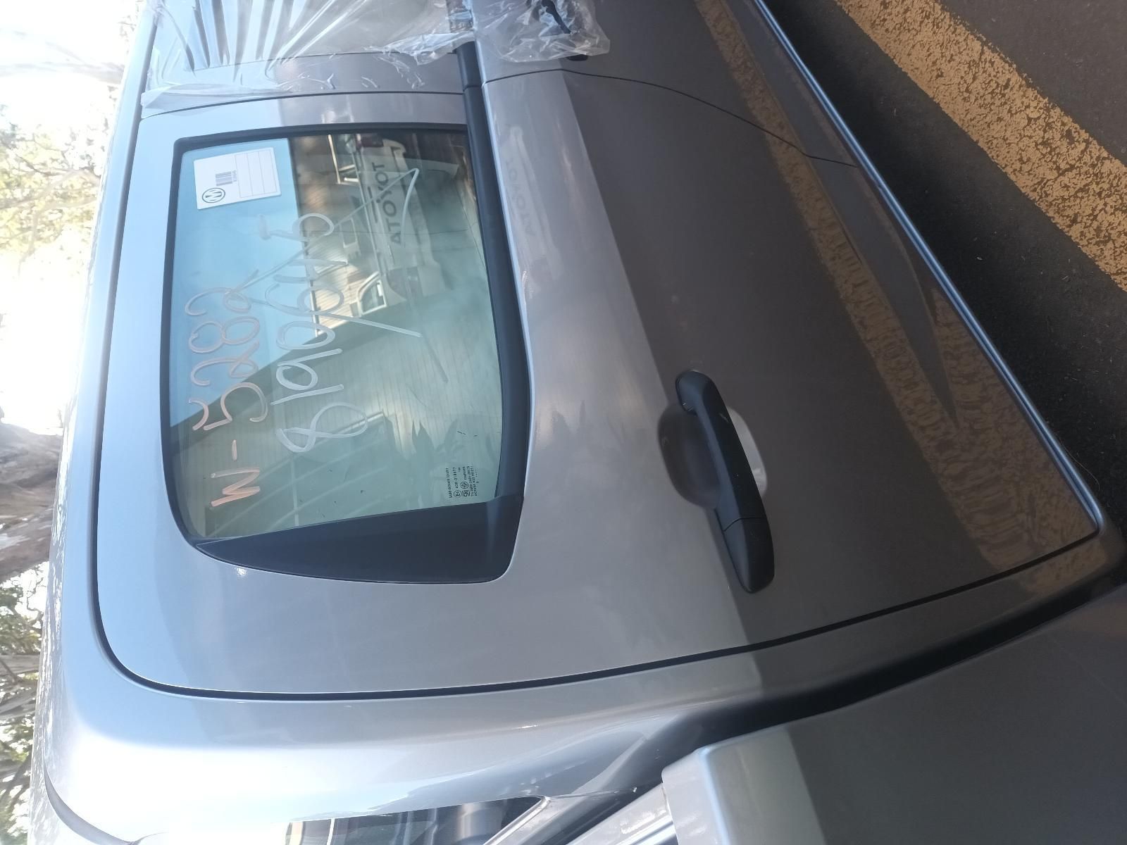 A Silver Car is Parked on the Side of the Road — South West 4WD Wreckers In Brisbane, QLD
