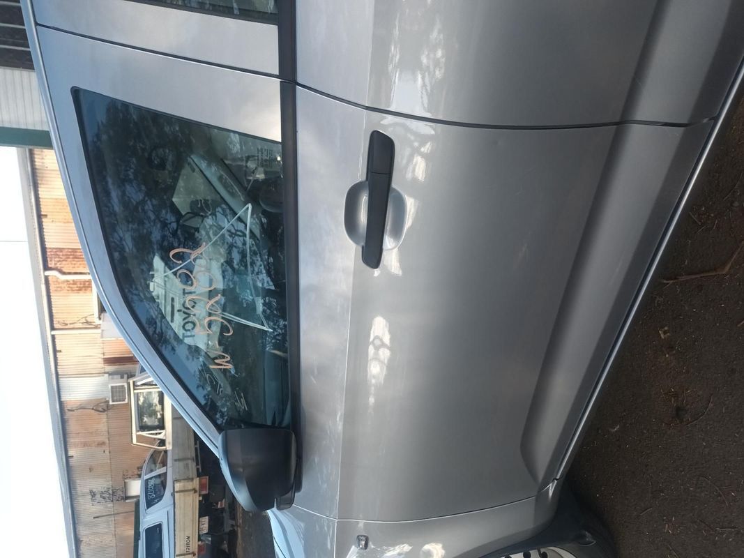 A Silver Car is Parked on the Side of the Road — South West 4WD Wreckers In Brisbane, QLD
