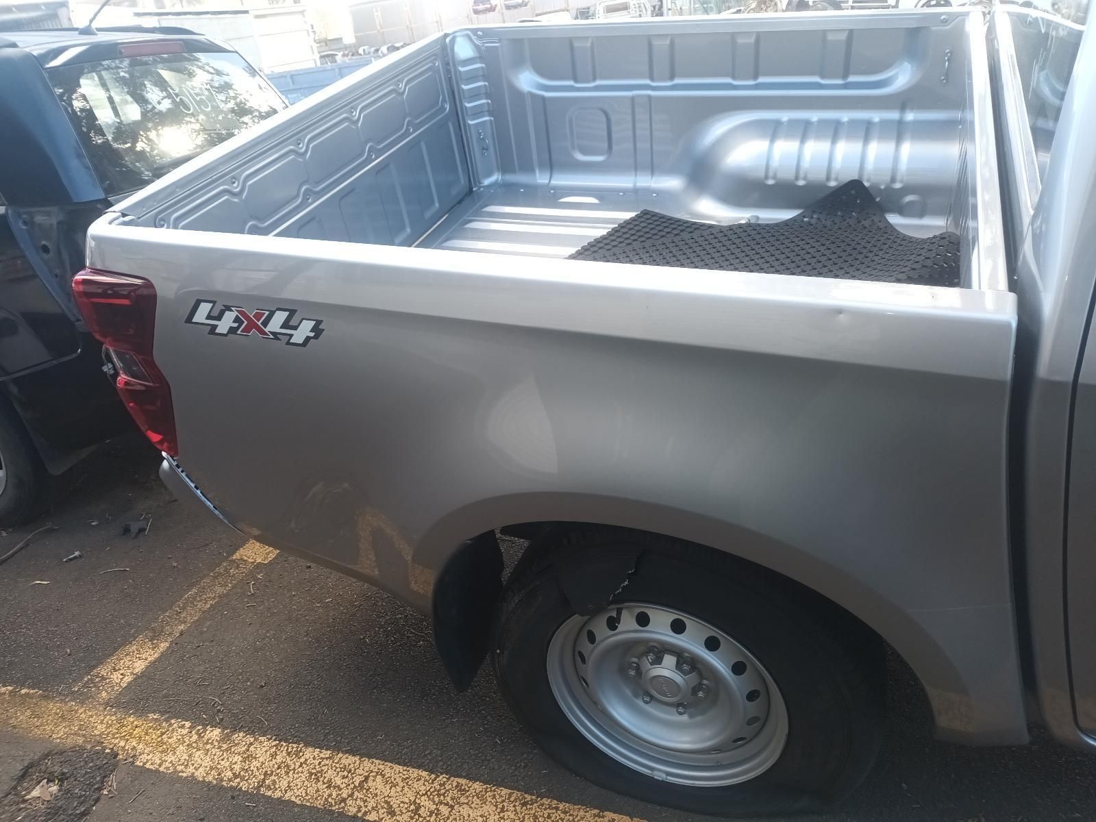 A Silver Pickup Truck is Parked in a Parking Lot — South West 4WD Wreckers In Brisbane, QLD