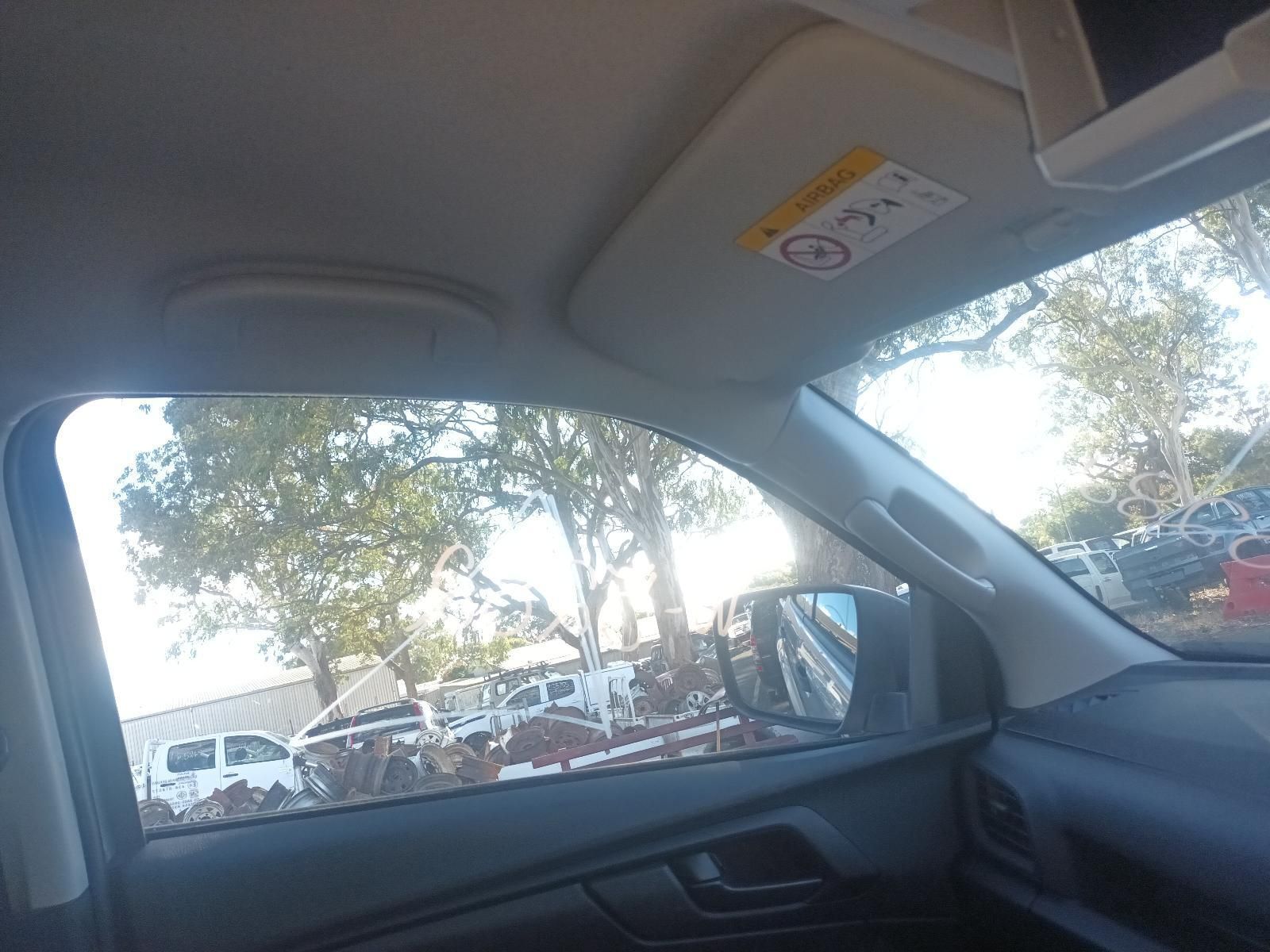 A Car with a Sun Visor That Says Airbag on It — South West 4WD Wreckers In Brisbane, QLD