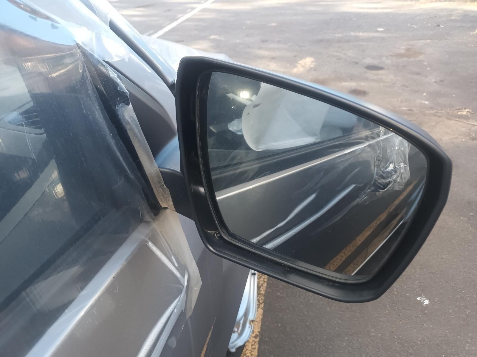A Close Up of a Car 's Side Mirror in a Parking Lot — South West 4WD Wreckers In Brisbane, QLD