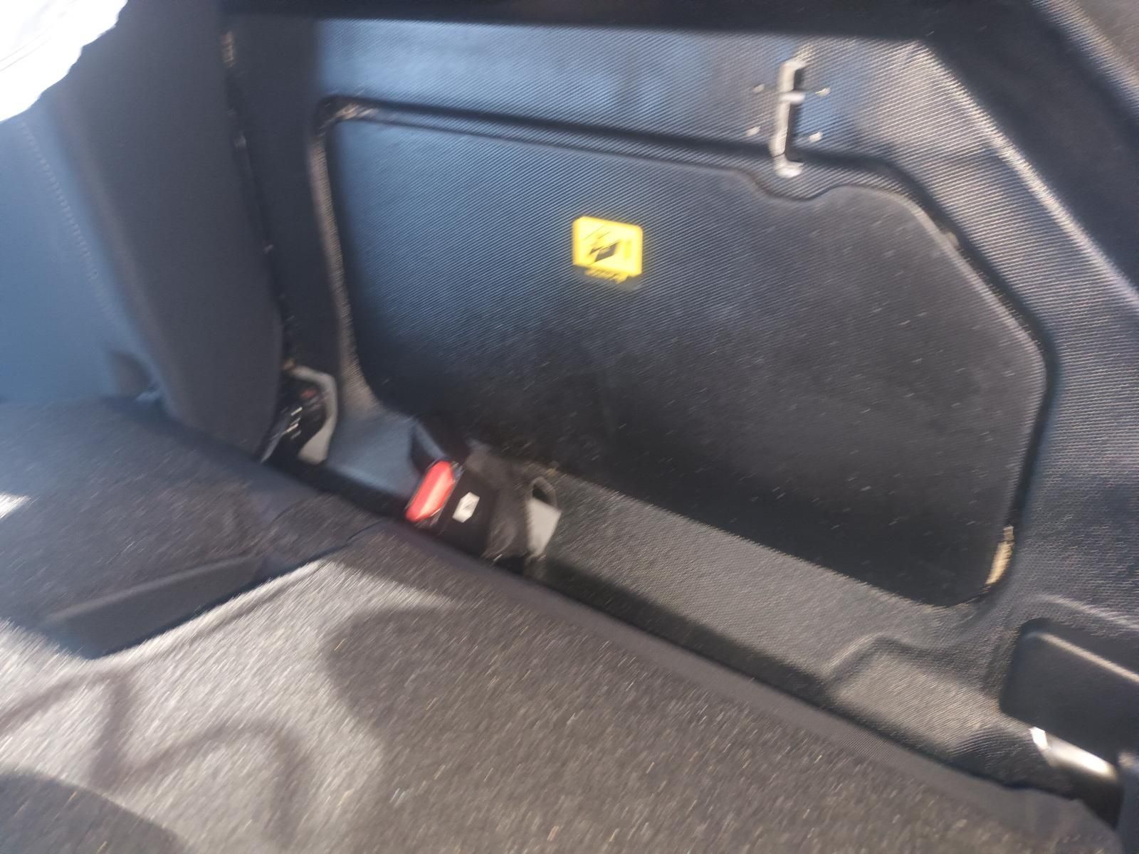 The Back Seat of a Car Has a Yellow Warning Sign on It — South West 4WD Wreckers In Brisbane, QLD