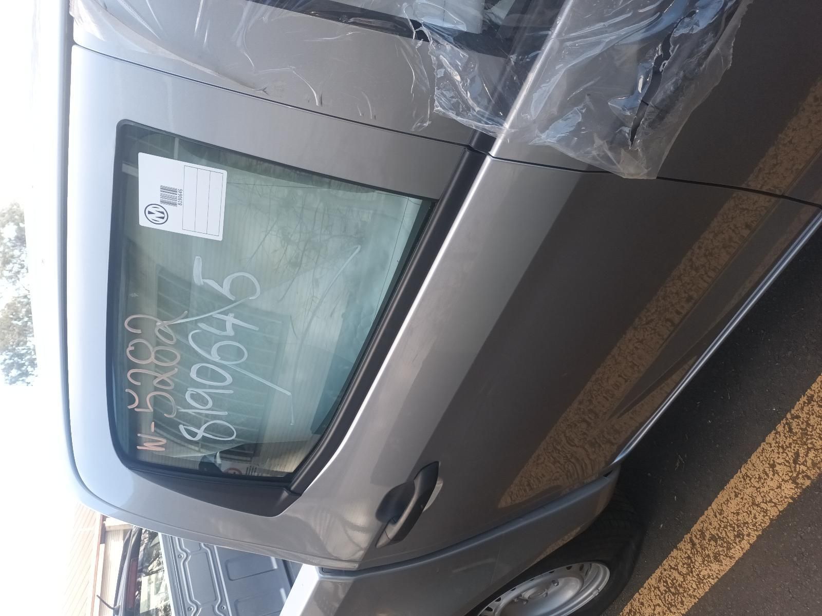 A Car is Wrapped in Plastic and Has a Sticker on the Window — South West 4WD Wreckers In Brisbane, QLD