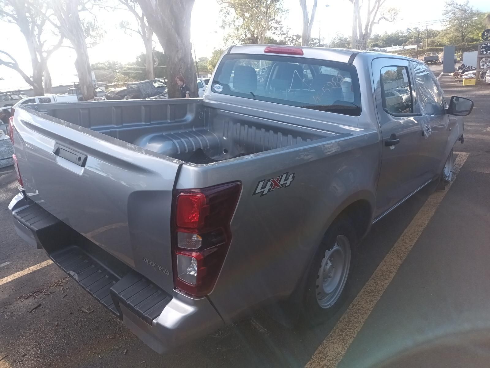 A Silver Pickup Truck is Parked in a Parking Lot — South West 4WD Wreckers In Brisbane, QLD