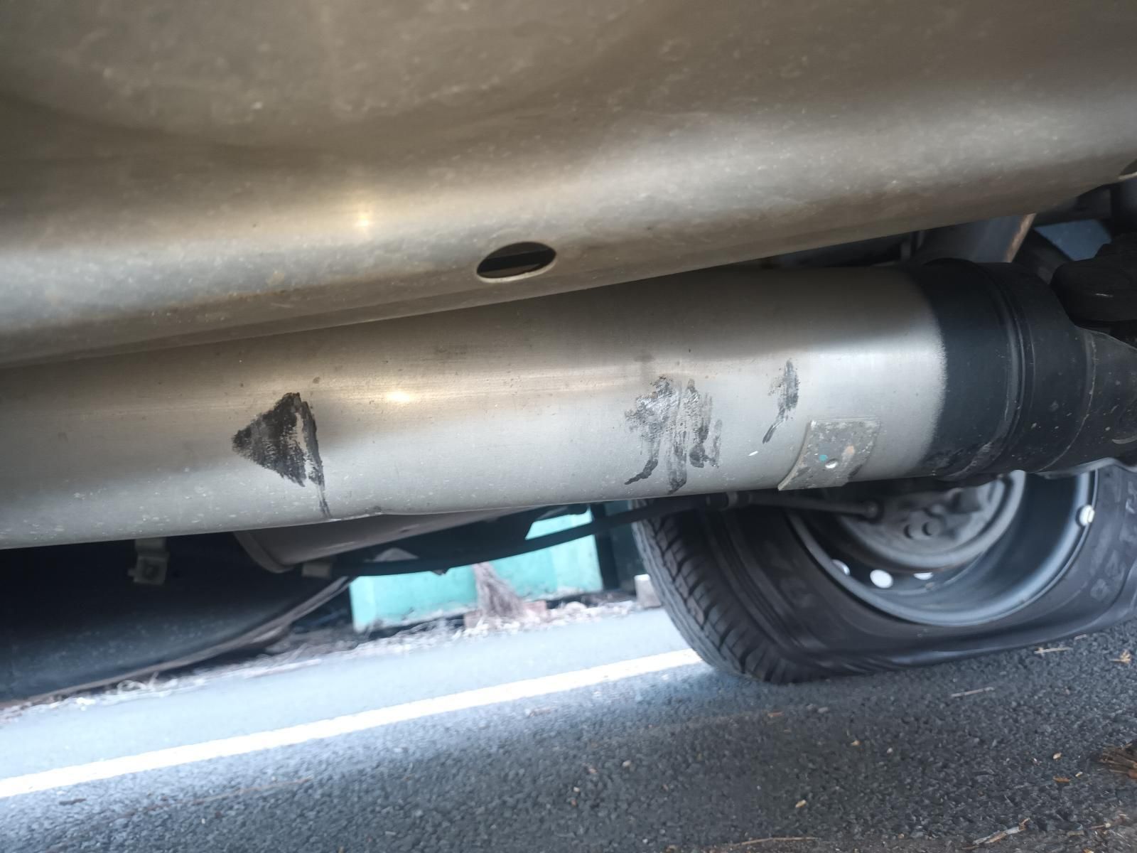 A Close Up of the Underside of a Car with a Flat Tire — South West 4WD Wreckers In Brisbane, QLD