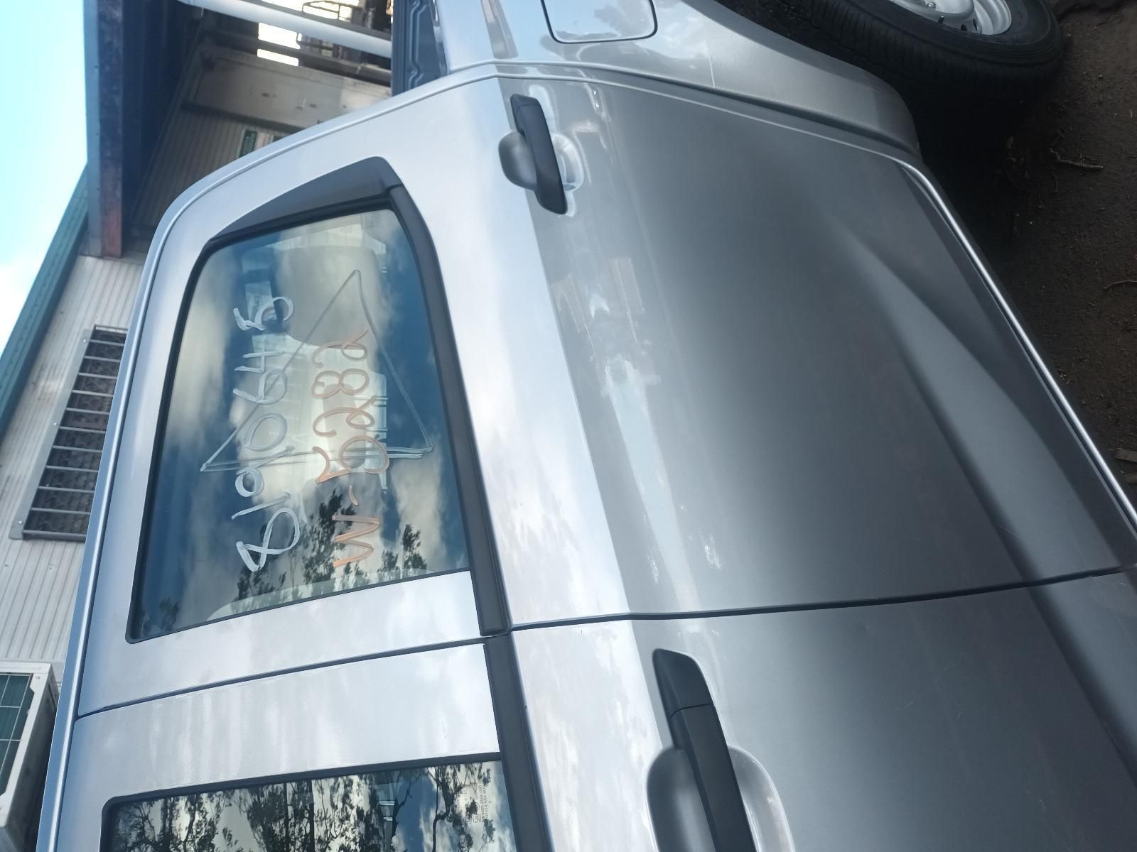A Silver Truck is Parked in Front of a Building — South West 4WD Wreckers In Brisbane, QLD