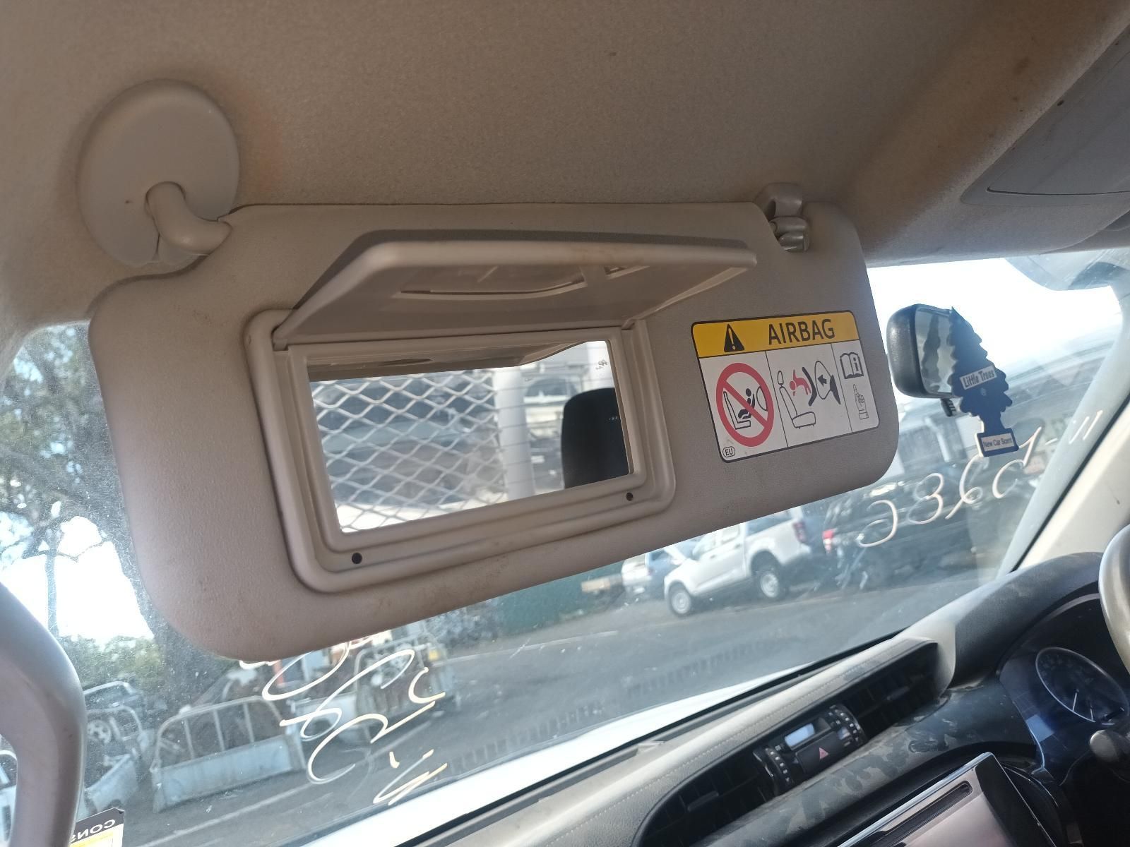 A Car with a Sun Visor and a Mirror on the Windshield — South West 4WD Wreckers In Brisbane, QLD