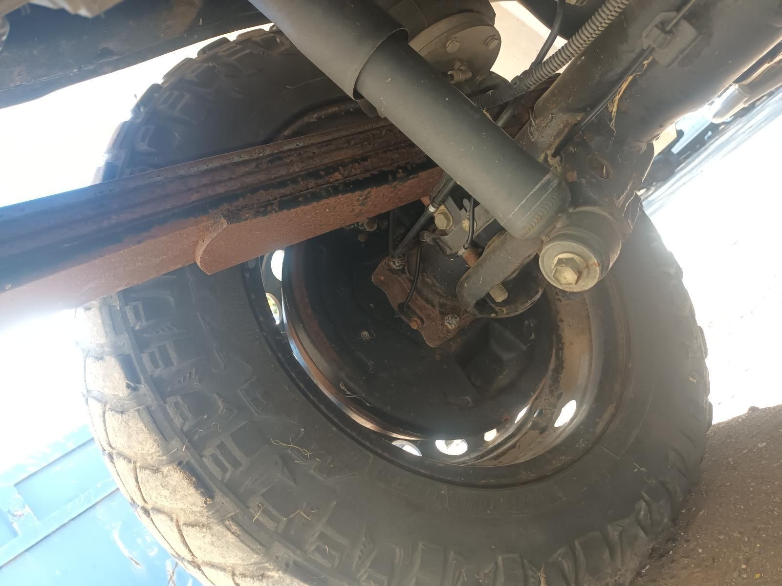 A Close Up of a Tire and Shock Absorber on a Truck — South West 4WD Wreckers In Brisbane, QLD