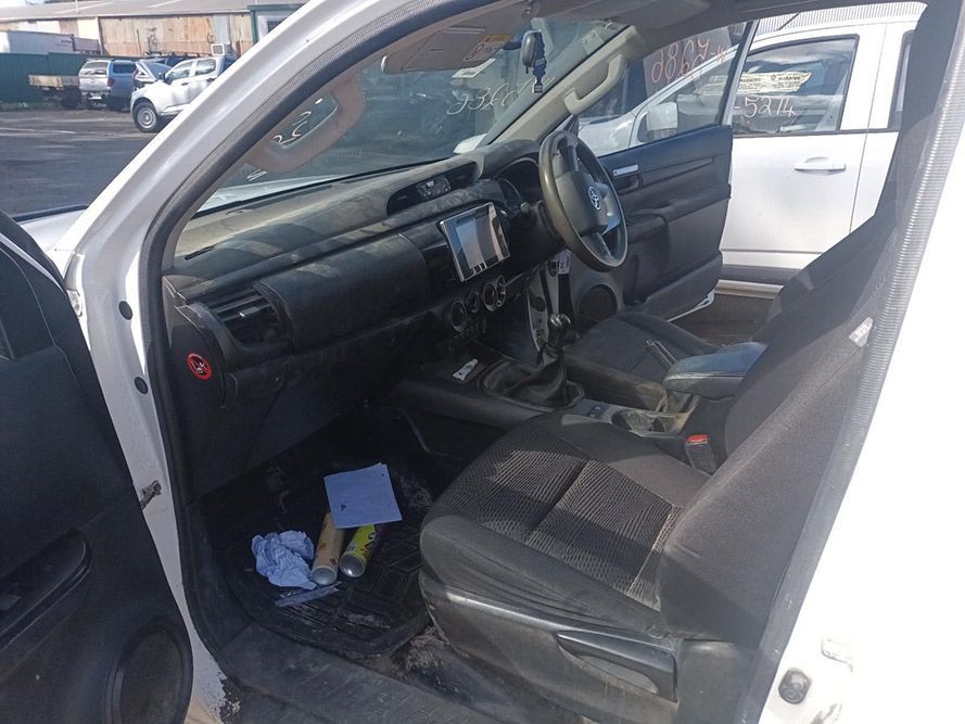 The Inside of a White Car with the Door Open — South West 4WD Wreckers In Brisbane, QLD