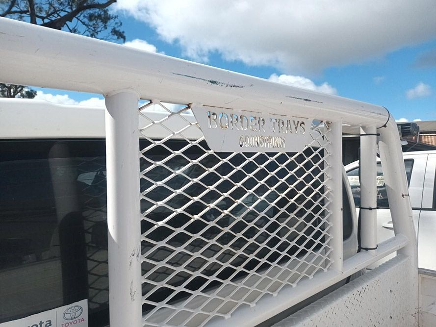 A White Truck with a Mesh Grille on the Back of It — South West 4WD Wreckers In Brisbane, QLD