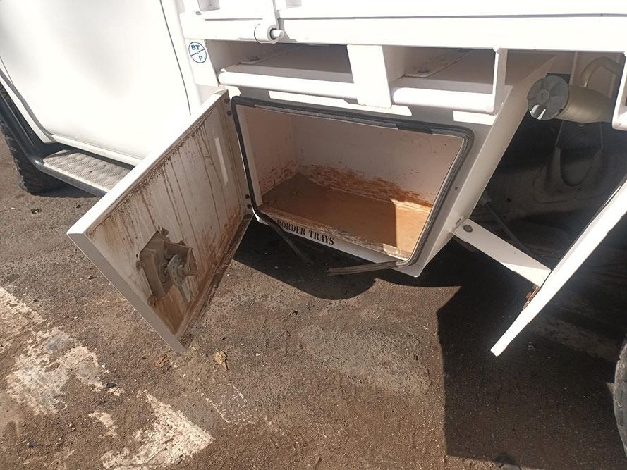 A White Truck with the Door Open and a Box Inside — South West 4WD Wreckers In Brisbane, QLD