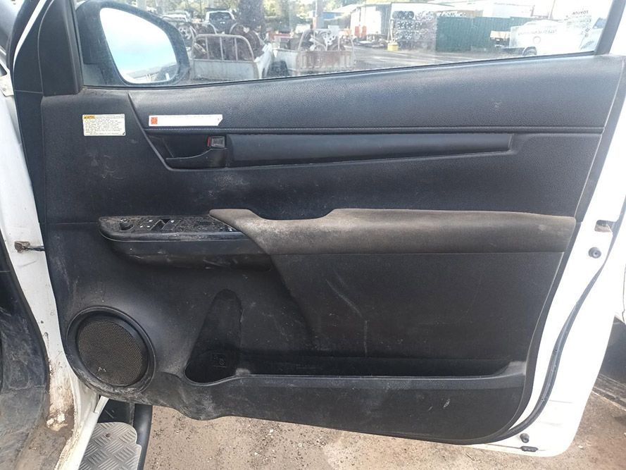 The Door Panel of a White Car is Dirty and Needs to Be Cleaned — South West 4WD Wreckers In Brisbane, QLD