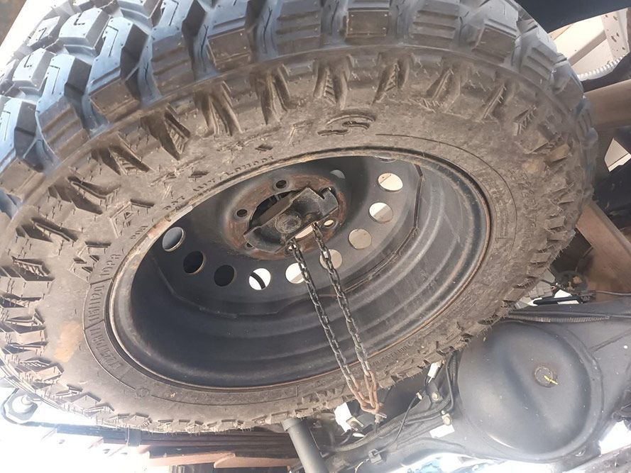 A Close Up of a Tire with a Chain Attached to It — South West 4WD Wreckers In Brisbane, QLD