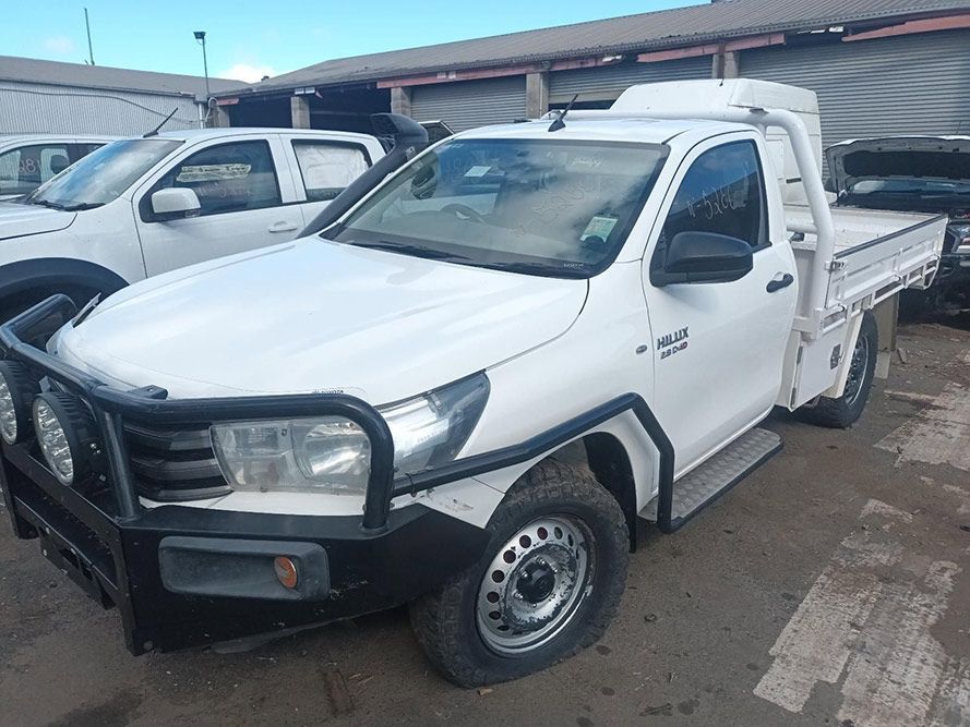 A White Truck with a Black Bumper is Parked in a Parking Lot — South West 4WD Wreckers In Brisbane, QLD