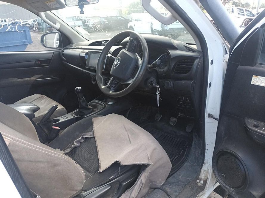 The Inside of a White Car with a Steering Wheel and Seats — South West 4WD Wreckers In Brisbane, QLD