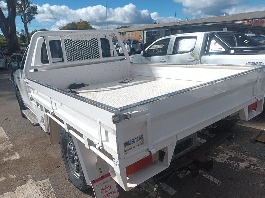 A White Toyota Truck is Parked in a Parking Lot — South West 4WD Wreckers In Brisbane, QLD