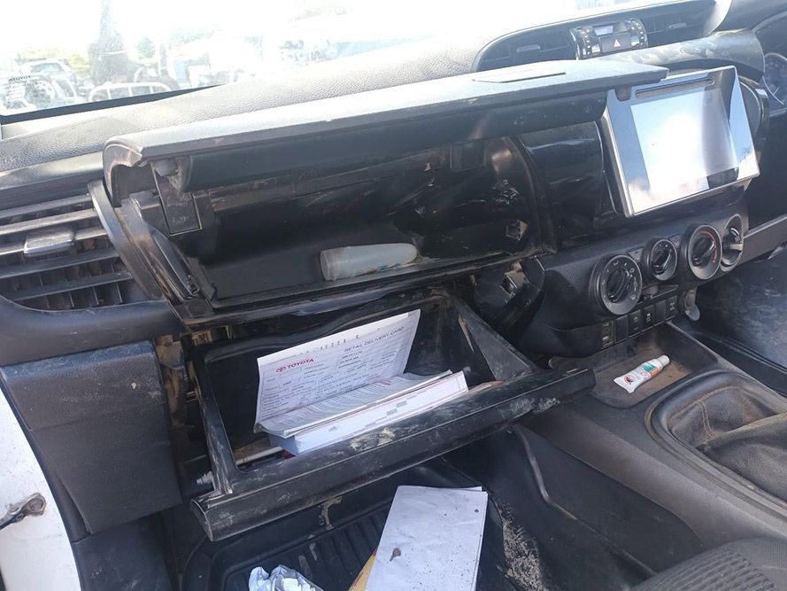 The Dashboard of a Car with the Glove Box Open — South West 4WD Wreckers In Brisbane, QLD