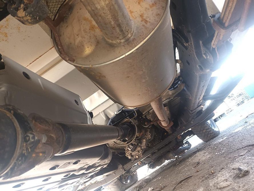 A Close Up of the Underside of a Car with an Exhaust Pipe — South West 4WD Wreckers In Brisbane, QLD