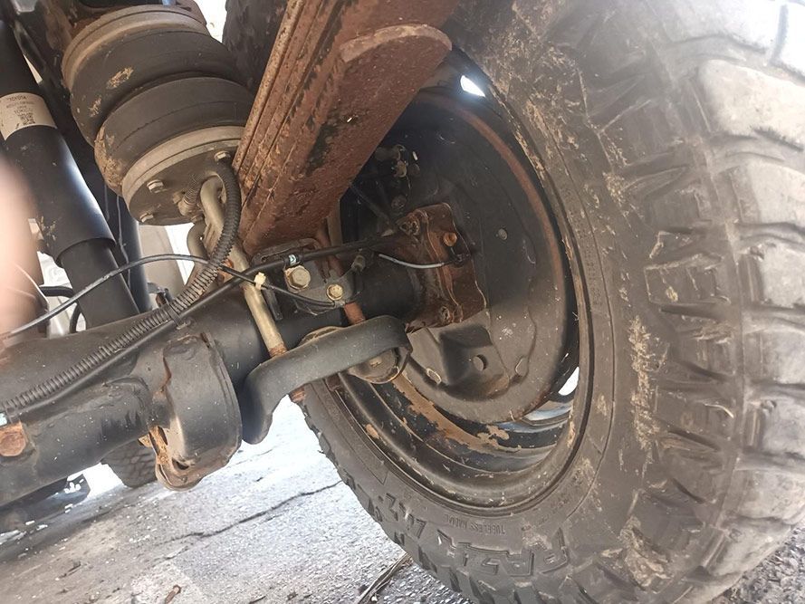 A Close Up of the Rear End of a Truck with a Large Tire — South West 4WD Wreckers In Brisbane, QLD