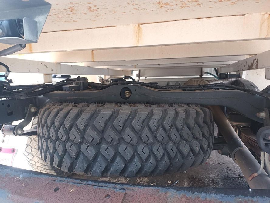 A Large Tire is on the Back of a Truck — South West 4WD Wreckers In Brisbane, QLD