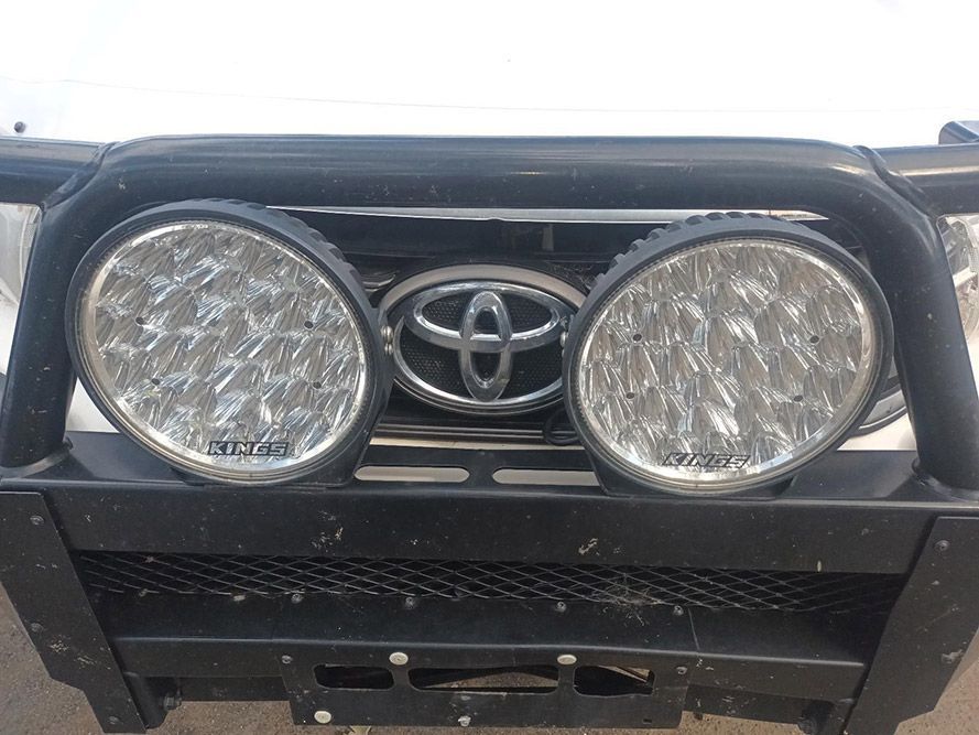 The Front of a White Toyota Truck with a Black Bumper and Lights — South West 4WD Wreckers In Brisbane, QLD