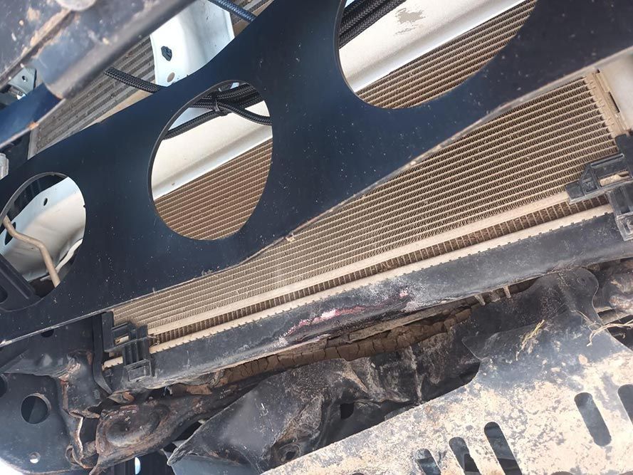 A Close Up of a Car Radiator with Holes in It — South West 4WD Wreckers In Brisbane, QLD