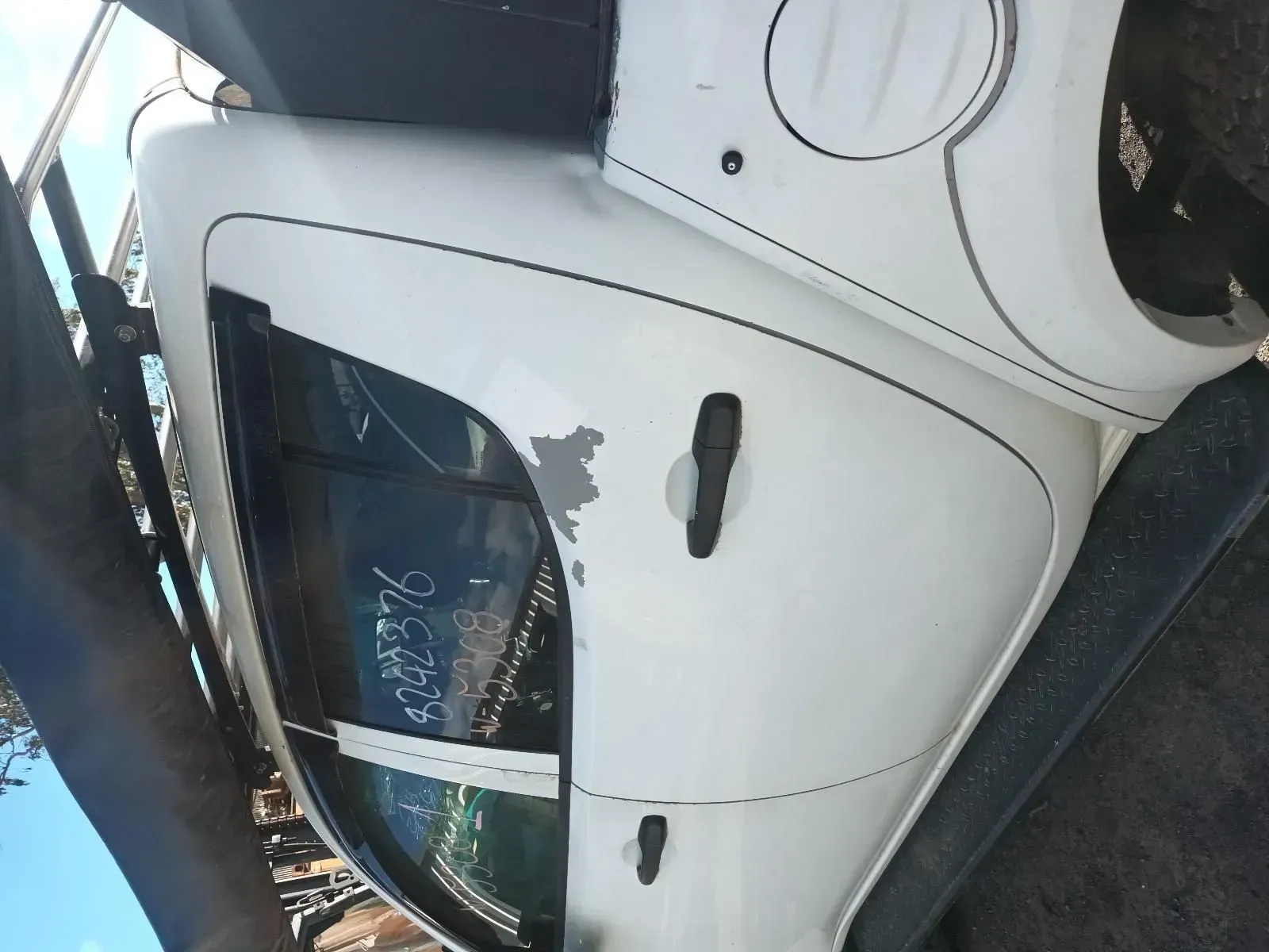 White Car Door With Visible Damage and a Window — South West 4WD Wreckers In Brisbane, QLD