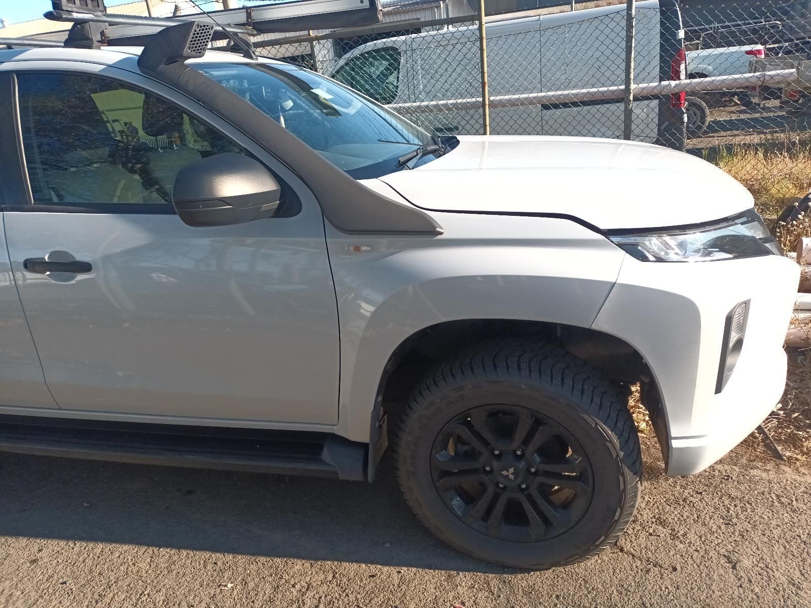 White Truck With a Black Snorkel and Black Wheels Parked Outside  — South West 4WD Wreckers In Brisbane, QLD