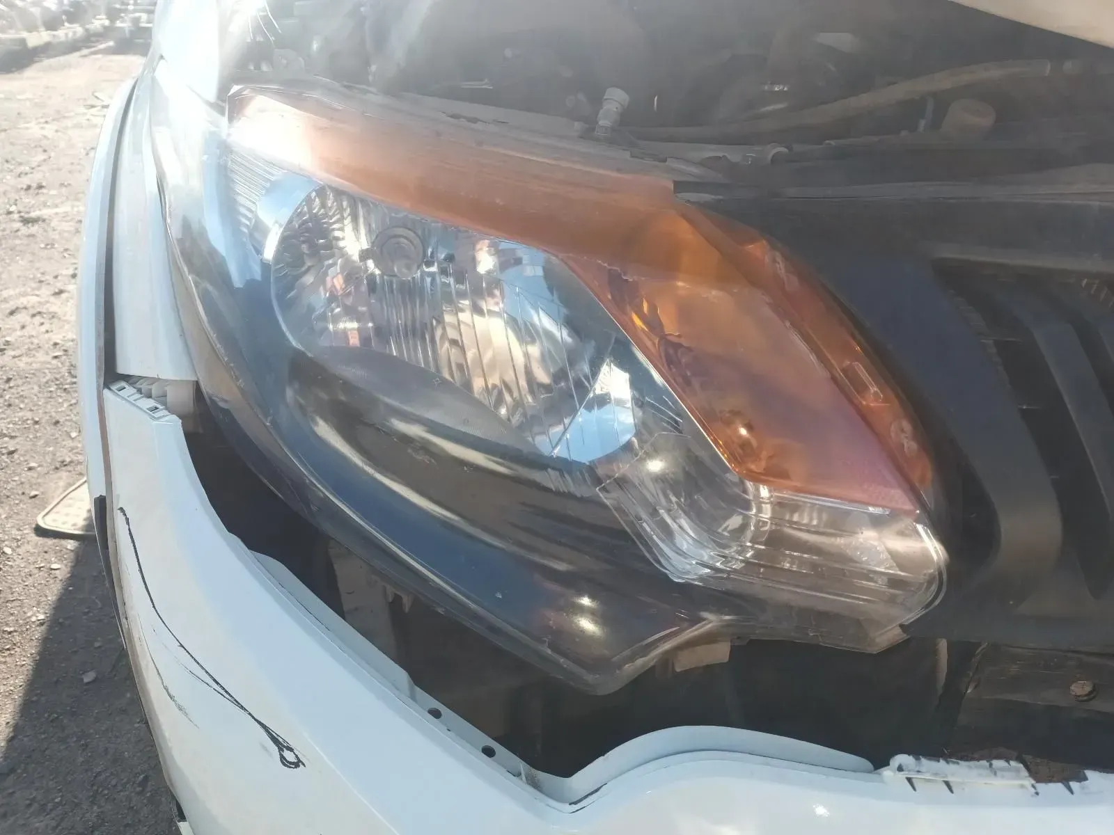 White Car Headlight With Orange Turn Signal and Black Trim — South West 4WD Wreckers In Harristown, QLD