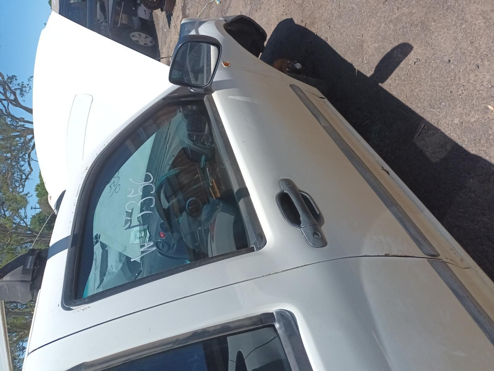 White Car Parked in Sunlight, Viewed from Above with A Side Mirror — South West 4WD Wreckers In Harristown, QLD